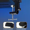 A close-up of a microphone boom arm clamp attached to a surface, with two inset images showing protective pads. Produktbild-Vorschau