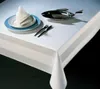 A table setting with a tablecloth, plate, napkin, cutlery, and a fish-shaped dish. Produktbild-Vorschau
