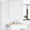 A white cabinet mounted on a white wall above a small kitchen cart. Produktbild-Vorschau