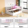 A white multifunctional bed frame with storage and LED lighting, shown in different configurations and angles. Produktbild-Vorschau