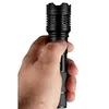 A hand holding a black flashlight. Náhled obrázku produktu