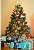 A decorated Christmas tree with presents underneath. Produktbild-Vorschau