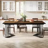 A dining table set up in a kitchen or dining area with chairs around it. Náhled obrázku produktu