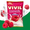 A product package for VIVIL CremeLife Raspberry candies, with raspberries and milk splashes. Produktbild-Vorschau