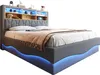 A modern upholstered bed with a headboard featuring shelves and integrated LED lighting. Voir les images du produit