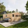 A wooden garden shed with double doors and windows, set on a wooden deck in a backyard with furniture and greenery. Anteprima dell’immagine prodotto