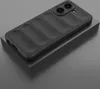 A black phone case with a ribbed texture is displayed on a gray pedestal against a gray background. Produktbild-Vorschau