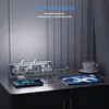A power strip with multiple outlets and USB ports is shown on a desk, charging a phone and a tablet. A cup of coffee is also on the desk. Produktbild-Vorschau