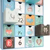 A close-up view of a blue advent calendar with 24 drawers, each decorated with festive animal illustrations and numbers. Náhľad obrázku produktu