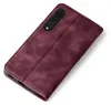 A burgundy flip cover phone case is shown against a white background. Produktbild-Vorschau