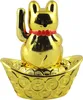 A golden Maneki Neko cat figurine sits on a boat filled with golden coins. Produktbild-Vorschau