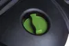 A close-up view of a green cap on a black surface. Náhľad obrázku produktu