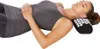 A woman is lying down with her head resting on an acupressure pillow. Podgląd zdjęcia produktu