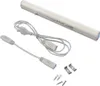 A white LED under-cabinet light with its accessories, including power cords and mounting hardware, laid out on a white background. Náhľad obrázku produktu
