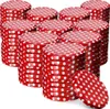 A collection of red and white polka dot jar lids stacked in various piles. Anteprima dell’immagine prodotto