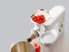 A kitchen appliance attachment for juicing strawberries is shown attached to a stand mixer. Anteprima dell’immagine prodotto