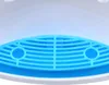 A close-up view of the blue grate and white base of a water dispenser. Podgląd zdjęcia produktu