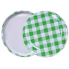 Two jar lids with a green and white checkered pattern are shown against a white background. Produktbild-Vorschau