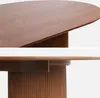 Close-up views of an oval wooden dining table with a fluted pedestal base. Produktbild-Vorschau