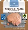 A close-up of tuna fish fillets in a box, with various certifications and branding visible. Produktbild-Vorschau
