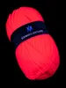 A ball of neon pink yarn with a black label wrapped around it, set against a black background. Produktbild-Vorschau