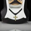 Close-up of a collectible figurine's chest area, showing a nun's habit and a cross necklace. Podgląd zdjęcia produktu