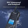 A close-up of a black walkie-talkie with water splashing around it, set against a dark blue background. Podgląd zdjęcia produktu