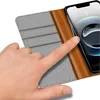 A close-up shot of a hand interacting with a phone case. Produktbild-Vorschau