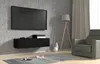 A modern living room with a wall-mounted TV and a black media console. Anteprima dell’immagine prodotto