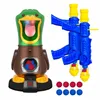 A toy duck shooting game with two toy guns and foam balls, set against a white background. Voir les images du produit