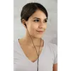 A woman wearing in-ear headphones. Anteprima dell’immagine prodotto