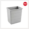 A light gray rectangular trash can bin with horizontal ridges on its sides, shown from a slightly elevated front-left angle against a white background. A red circular logo with the word "Hailo" in white text is in the top right corner. Produktbild-Vorschau