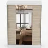 A wardrobe with mirrored doors reflecting a bedroom interior. Voir les images du produit