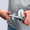 A person is using a pipe cutter to cut a pipe. Produktbild-Vorschau