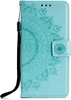 A teal flip case cover for a Samsung Galaxy S10e with a mandala pattern embossed on it. Produktbild-Vorschau