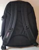The back of a black Eastpak backpack is shown against a light-colored wall. Anteprima dell’immagine prodotto