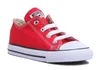 A single red Converse Chuck Taylor All Star sneaker is shown from a side-angle on a white background. Voir les images du produit