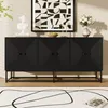 A black sideboard with a geometric pattern on the doors is displayed in a room with a large abstract artwork on the wall and a rug on the floor. Voir les images du produit
