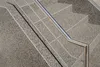 A close-up view of a granite staircase with a metal handrail. Produktbild-Vorschau