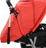 A close-up view of a red and black tandem stroller. Náhled obrázku produktu
