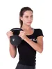 A woman holding a kettlebell. Produktbild-Vorschau