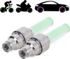 Silhouettes of a cyclist, motorcyclist, and car with glowing wheels are shown above two green glowing valve caps. Náhľad obrázku produktu