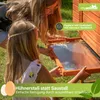 Two girls are interacting with a wooden chicken coop outdoors. Produktbild-Vorschau