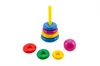 A stacking ring toy and a ball are arranged on a white background. Podgląd zdjęcia produktu