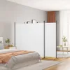 A bedroom scene with a bed, nightstand, and a room divider. Náhled obrázku produktu