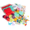 A collection of colorful building blocks and gears, along with a sticker sheet, are spread out on a white background. Podgląd zdjęcia produktu