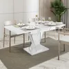 A dining table set up for a meal in a modern dining room. Produktbild-Vorschau