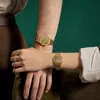 Two people's arms are crossed, both wearing gold Casio watches. Voir les images du produit