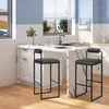 A modern kitchen with a marble-topped island and two dark gray bar stools. Produktbild-Vorschau