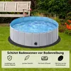 A round pool with blue water sits on a green lawn, with a wooden bench and foliage in the background. Text overlays describe product features. Produktbild-Vorschau